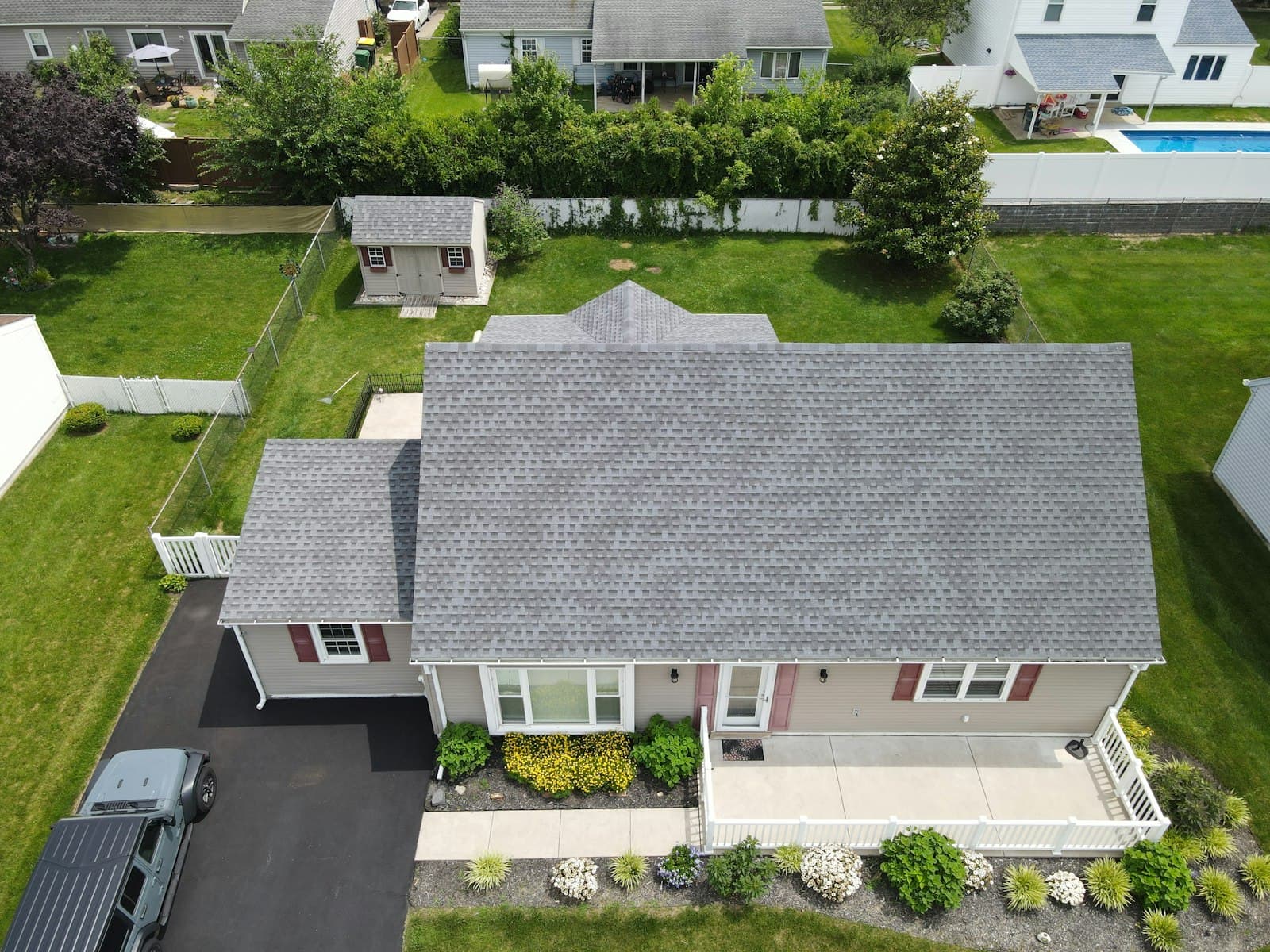 Newly replaced shingle roof on a suburban home